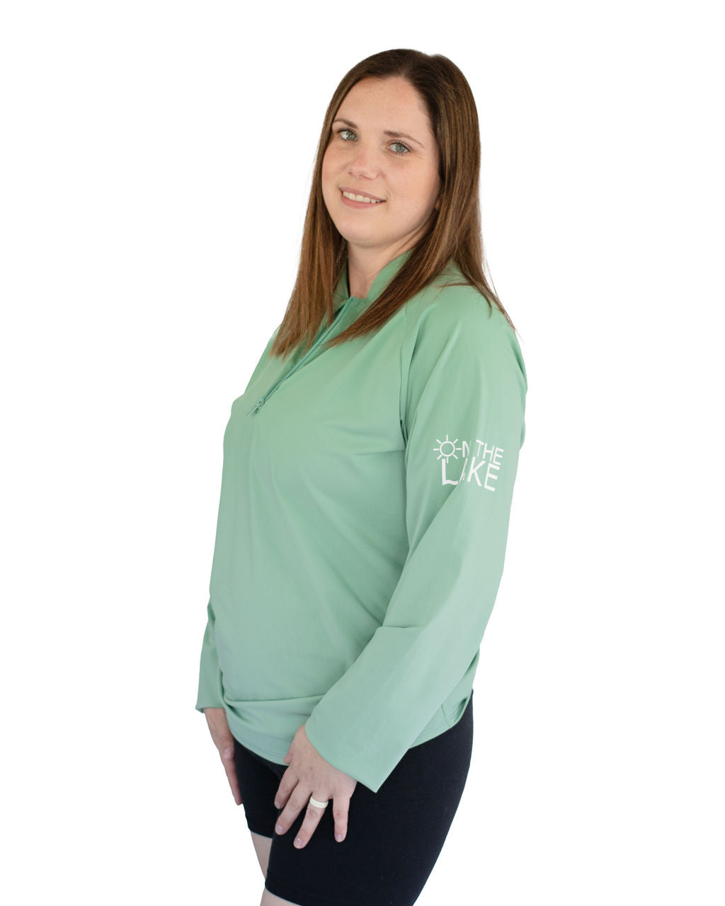 Adult UPF 50+ natural sun protection swimwear clothing Canada, UPF 50+ swimwear, Sun protective clothing, UV swimwear, Sun-safe apparel, UV protection for water activities, Sun-blocking swimwear, Family sun protection clothing, Sun safe boating attire, woman fishing in soft green UPF 50+ shirt