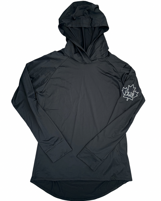 Women/Men's black UPF 50+ sun protection long sleeve hooded shirt, front view with "On The Lake" inside a maple leaf logo on the upper left sleeve, for fishing, boating, and outdoor summer wear