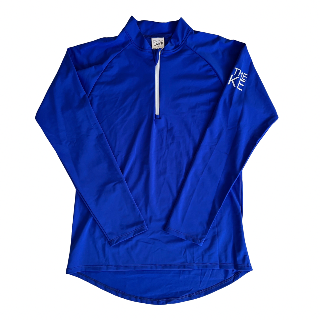 Adult UPF 50+ natural sun protection swimwear clothing Canada, UPF 50+ swimwear, Sun protective clothing, UV swimwear, Sun-safe apparel, UV protection for water activities, Sun-blocking swimwear, Family sun protection clothing, Sun safe boating attire, woman fishing in royal blue UPF 50+ shirt